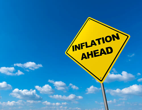 A yellow road sign that reads Inflation Ahead